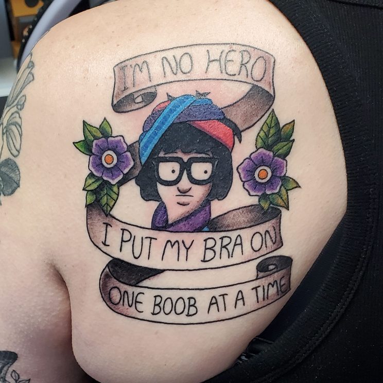 Tina Belcher from Bob's Burgers with headbands on and traditional flower with banner quote