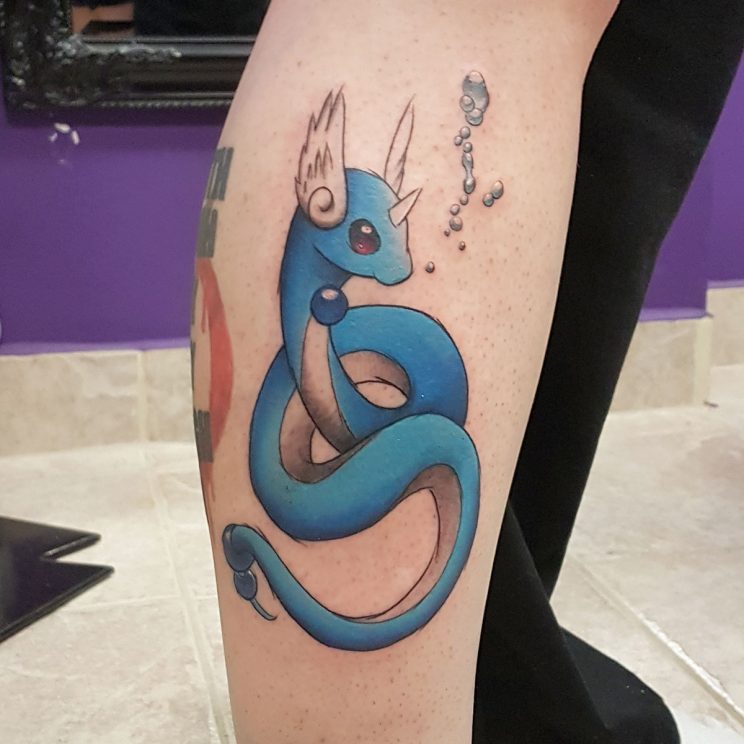 Dragonair pokemon tattoo with bubbles on side of leg