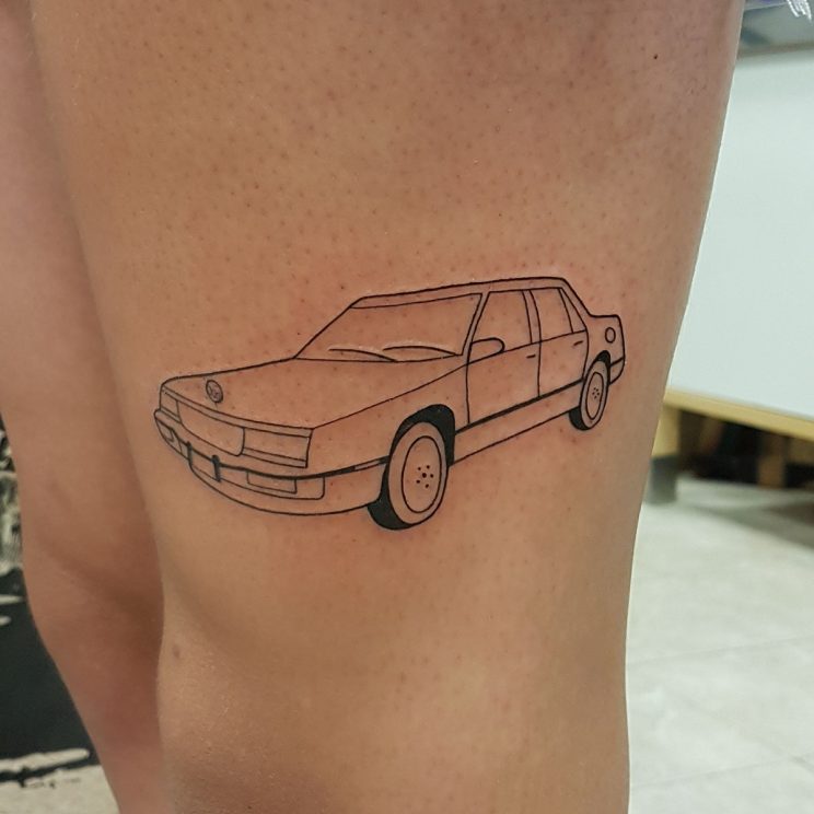 Minimalist tattoo of a car illustration.