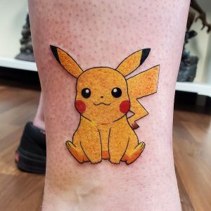 Full colour Pikachu tattoo on ankle.