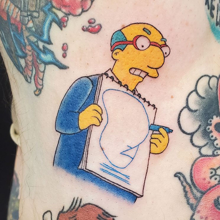 Kirk Van Houten holding up his own drawing of dignity, from the Simpson's TV episode.